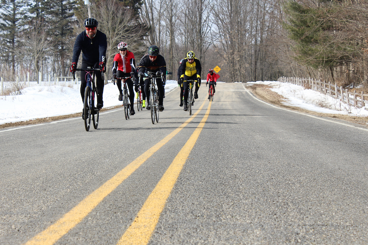 A group of cyclists rides through Mount Pleasant on March 9, 2019.