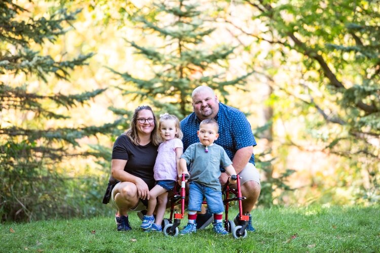 Aaron and Marilee Faist pose with their son, 7-year-old Ian, and daughter, 3-year-old Morgan. The family hopes that sharing the challenges they face for Ian will encourage people to build a more inclusive world. (Photo courtesy of the Faist family)