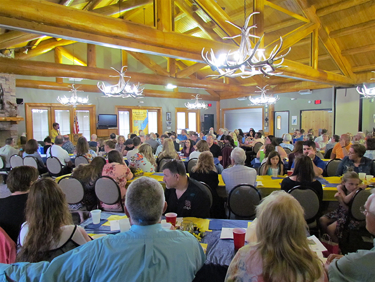 Crowd at festival banquet at tribal center.