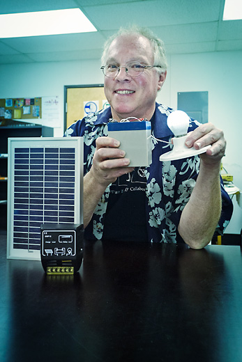 John Barrie with his solar lighting system