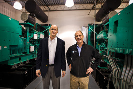 L to R Mike Klein and Yan Ness with the twin power generators at Online Tech in Ann Arbor