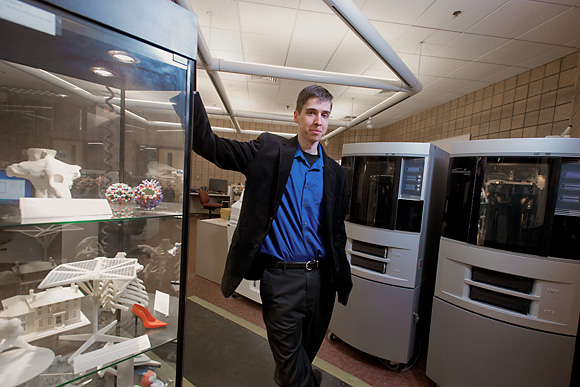Eric Maslowski in front of the 3D printers at the U of M 3D Lab