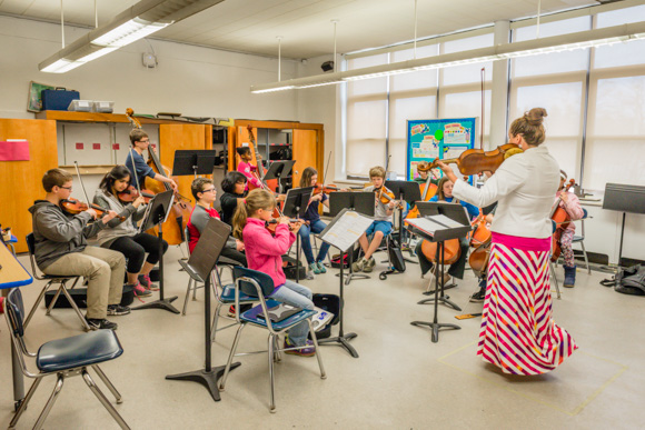 Orchestra teacher Kristi Luckritz with her students at Ann Arbor STEAM 
