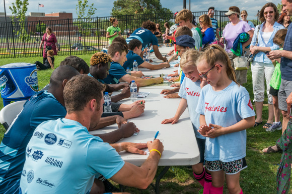 AFC Ann Arbor signing autographs for fans after the game