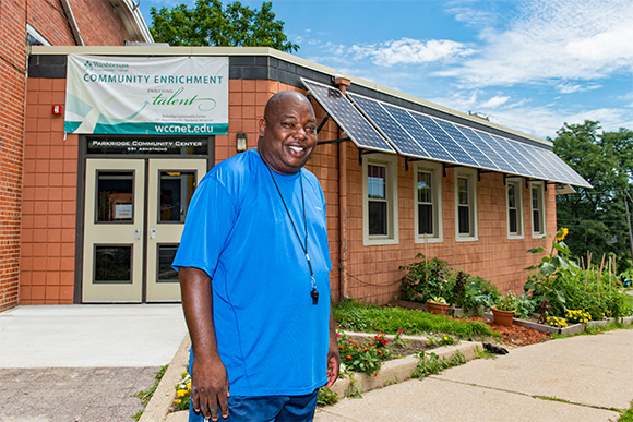Community Enrichment Director Anthony Williamson with solar panels on the Parkridge Community Center