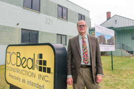 Fred Beal in front of the future Kingsley Condominiums