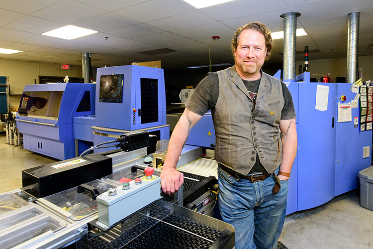 Kevin Spall with a digital printer at the Thomson-Shore plant
