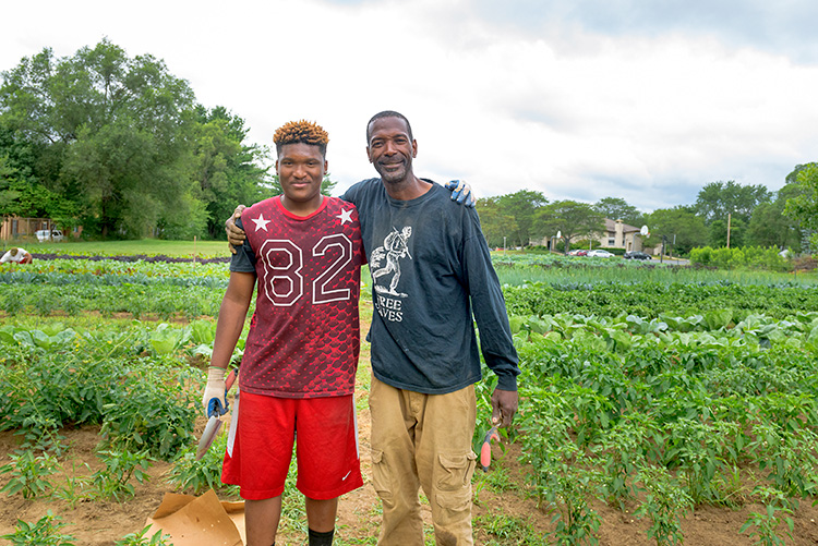 Melvin Parson and Jamari Jefferson at We The People Growers Association gardens