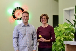 Atomic Object managing partner John Fisher with Koester Performance Research founder Heidi Koester. Koester holds a switch typically used in a switch scanning system.