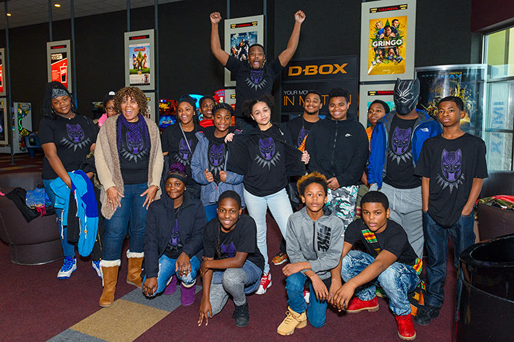 Jermaine Dickerson of Hero Nation with YCHS students at a Black Panther screening at Rave Cinemas
