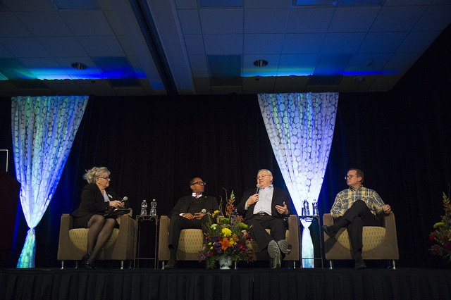 Michelle Mueller, Eugene Grant, Craig Hupy, and James R. Sayer participate in a panel discussion.
