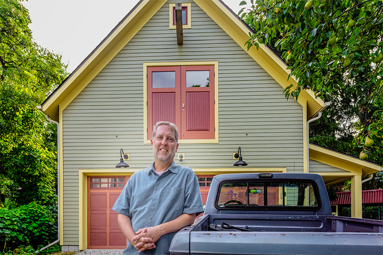 Richard Norton in front of his new garage on the Old West Side of Ann Arbor