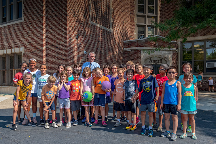 Principal Gary Court with students at Angell Elementary