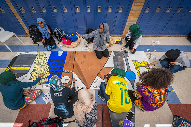 WiHi's Muslim Student Association painting a mural for WiHi's 8th International Dinner