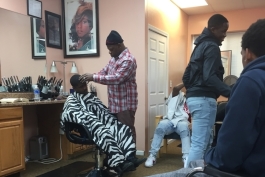 A Brother to Brother mentee gets a haircut from Shawn Green, Brother to Brother mentor and owner of Finesse 1 barbershop.