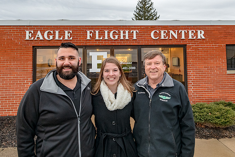 Tom Simon, Anna Buchel and Jerard Delaney at the Eagle Flight Centre at Willow Run Airport