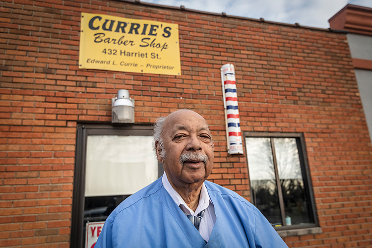 Owner Edward Currie outside Currie's Barber Shop