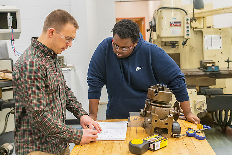 Grizzly Robotics mentor Tom Serbowicz and student Dante Swanigan