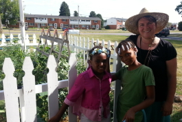 YDL-Superior branch manager Mary Garboden poses with kids at the branch's garden in 2016.