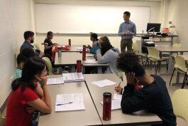 Concentrate managing editor Patrick Dunn leads a writing workshop with Upward Bound students.