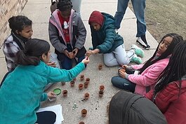 Since November 2019, A2Zero has held multiple community engagement events to discuss action planning and hear public feedback for becoming carbon neutral in 2030. Here, local students plant flowers as part of this community engagement campaign.