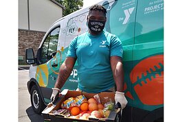 With funding from the U.S. Department of Agriculture, Ann Arbor YMCA has been distributing produce boxes weekly for families in need during the pandemic.