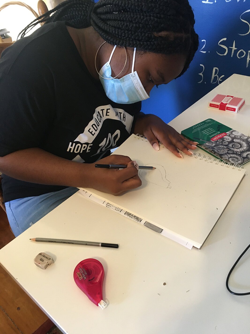 Kierra Owens participates in art class at Educate Youth's clubhouse.