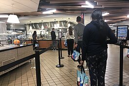 Students line up at a U-M dining hall.