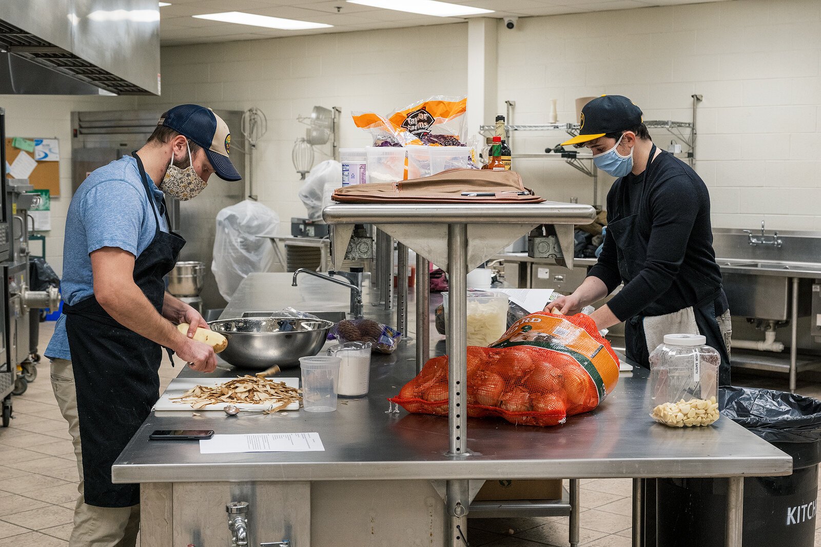Forrest Maddox and Bryan Santos, owners of the White Pine Kitchen, prepare food.