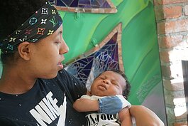 A mom and baby at Corner Health Center, one of the organizations supported by Jim and Marla Gousseff's endowment.
