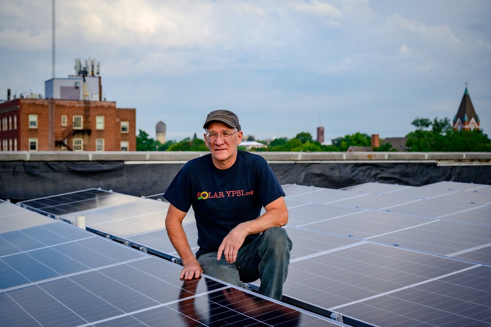 Dave Strenski among the solar panels on the roof of Riverside Arts Center.