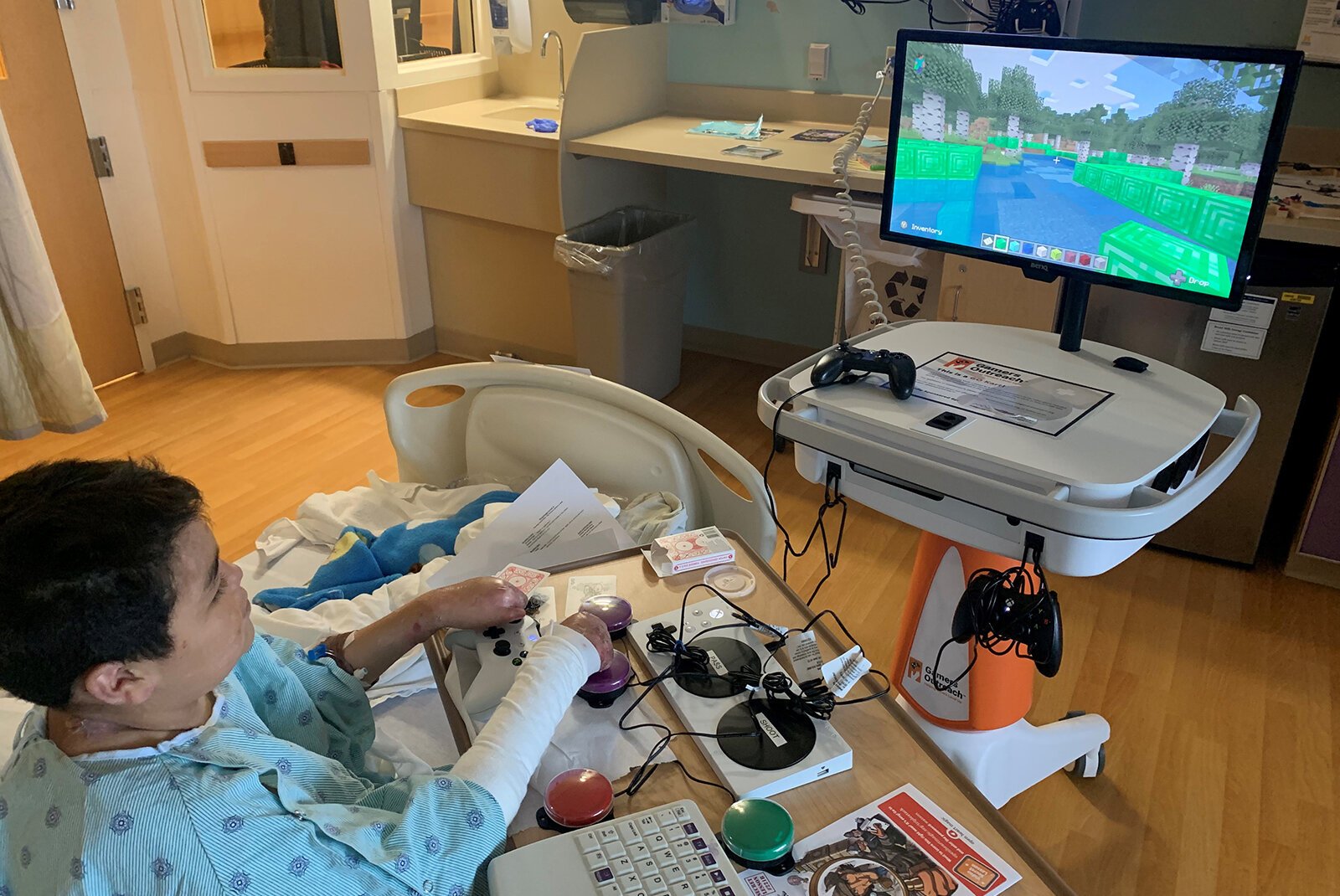 A Mott Children's Hospital patient plays a video game.