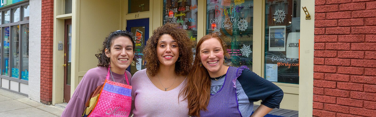Sierra Lambert, Gabrielle Watts, and Maria Pomo Castillo at Bridge Community Cafe.