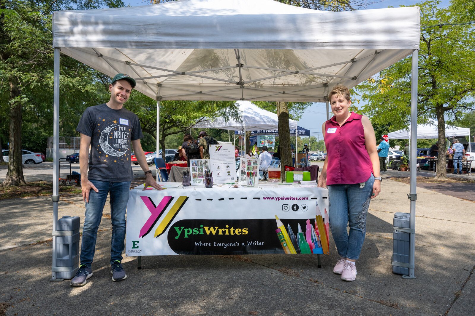 Brent Miller and Melissa Brooks-Yip at YpsiWrites' Love Letters to Ypsilanti booth at the Ypsilanti Depot Town Farmers Market.