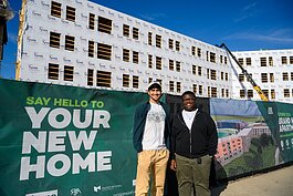 Auryon Azar and Cedrick Charles in front of the future New Lakeview Apartments at EMU.