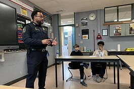 Ypsilanti Police Chief Kirk Moore speaks to Ypsilanti Community Middle School students about policing as the students prepare to interview the candidates for Washtenaw County sheriff.