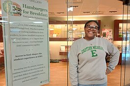 EMU historic preservation student Akaiia Ridley at "Hamburgers for Breakfast," the current student-created exhibit at McKenny Gallery.
