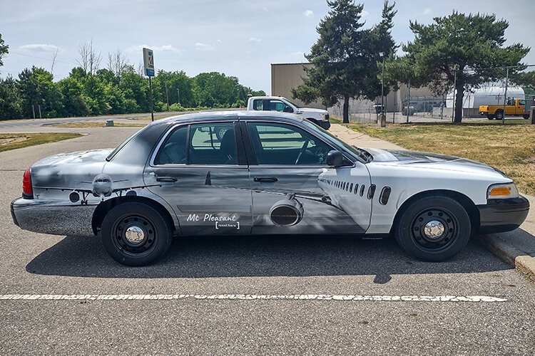 A police car from the City’s fleet has been redesigned and repurposed to provide transportation for visiting flight crews and pilots throughout town from the Mt. Pleasant Municipal Airport, located at 5453 E Airport Rd.