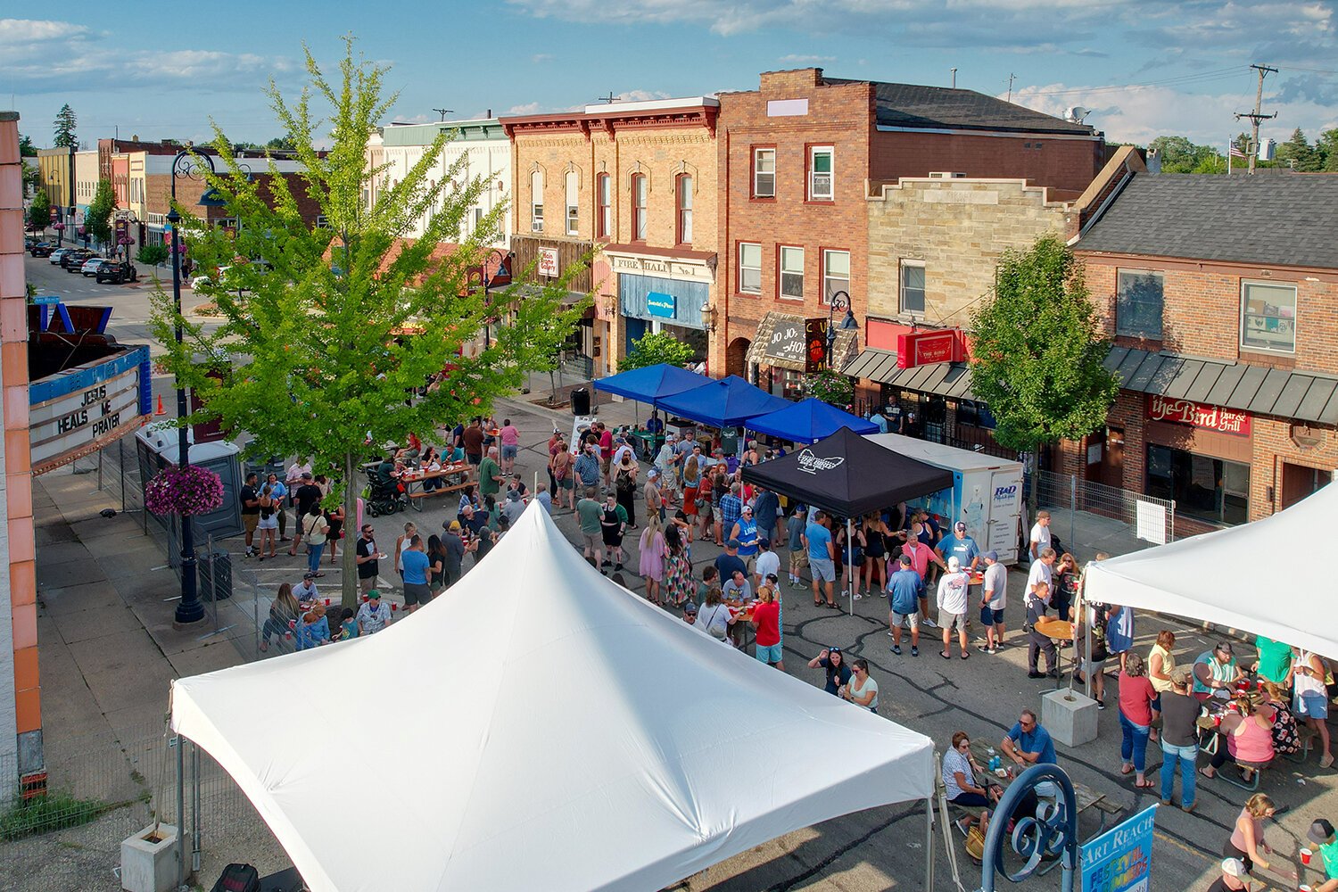 Revelers fill Main Street to celebrate the 90th anniversary of The Bird Bar and Grill in Mt. Pleasant, MI on Saturday, July 29, 2023.