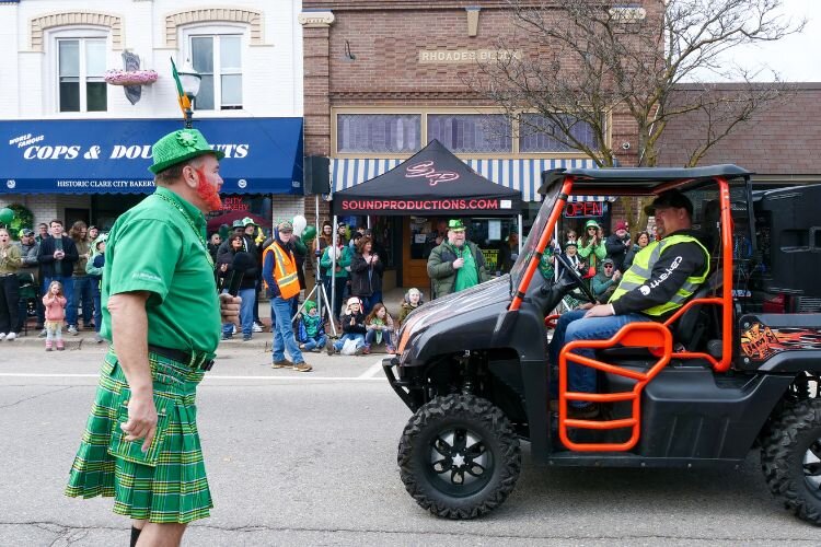 Greg “Ryno” Rynearson, clad in Irish apparel, assists in emceeing the 49th Annual Clare Irish Festival parade, paying homage to event organizers.