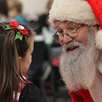 Young girl meets Santa at the Mt. Pleasant Christmas Celebration