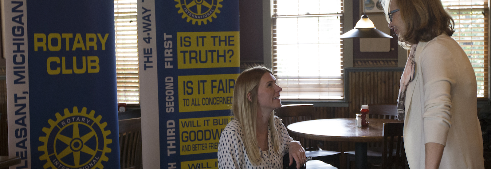 Mt. Pleasant Rotary Club President Alysha Fisher and Peggy Pickler chat prior to the club's meeting at Mountain Town Station on Monday, Oct. 8, 2018.