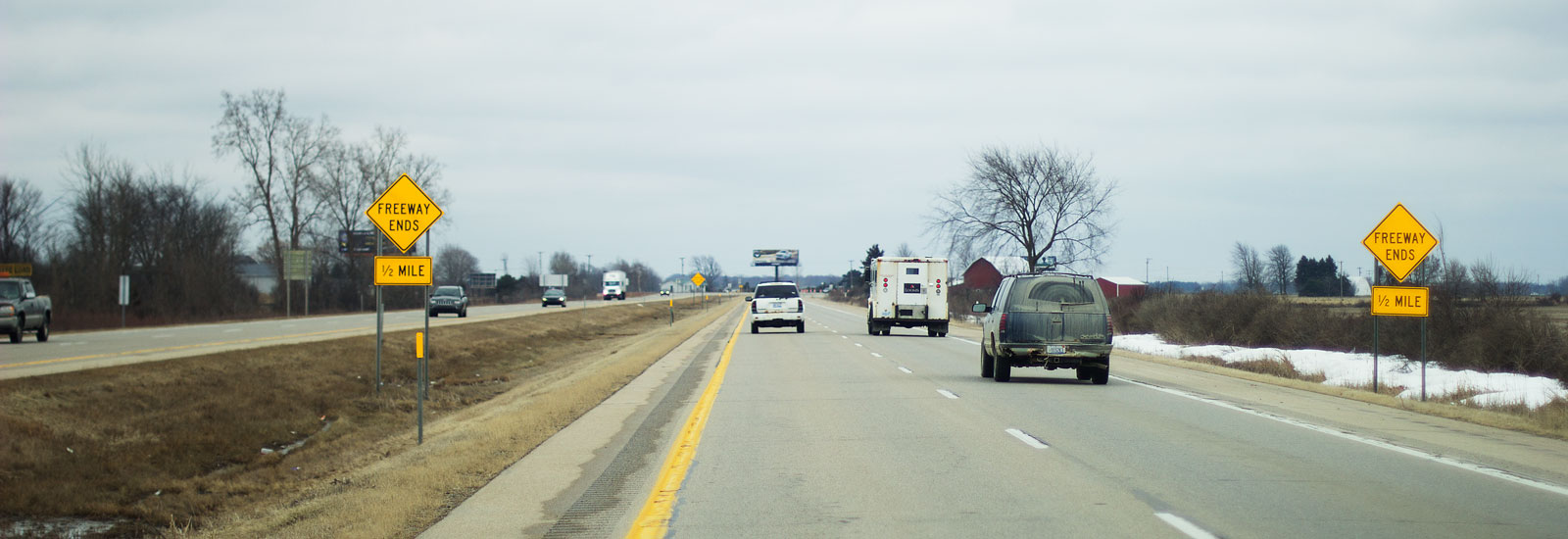 Signs warn motorists that the limited-access freeway ends in 1/2 mile on Southbound US-127 near Ithaca, MI