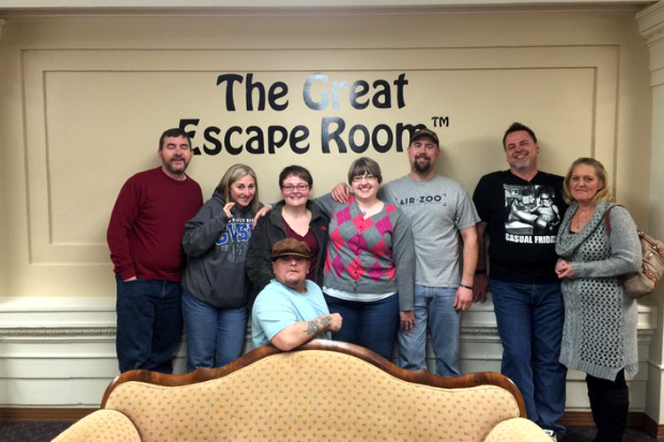 Glen and Christine Brown (second and first from right) of Portage, and friends, after solving their puzzle to escape The Game Room at The Great Escape Room, Grand Rapids.