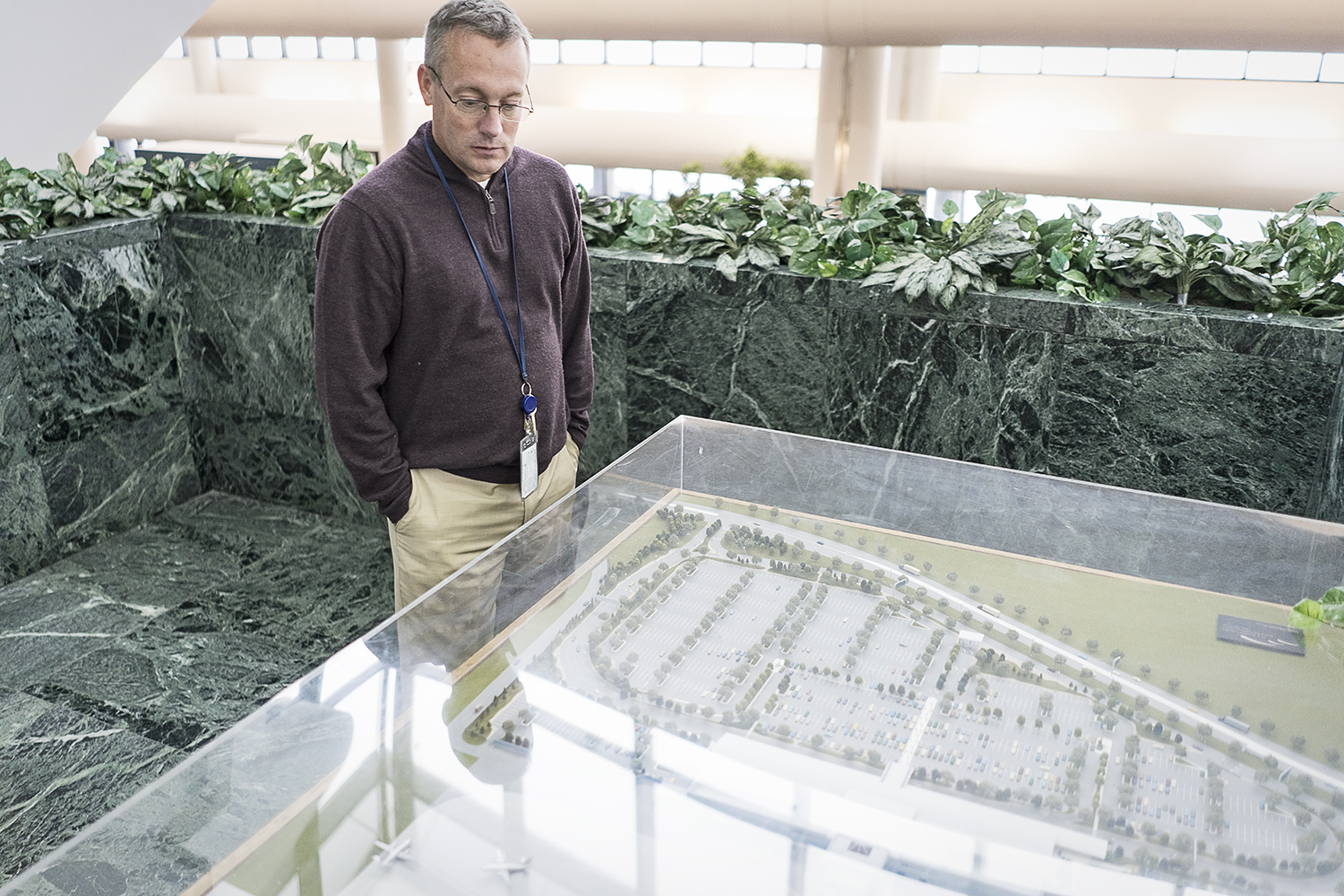 Bishop International Airport Director Craig Williams, 48, of Fenton, looks at the scale model of Bishop as it was envisioned in the early 1990s. Remarkably, the airport has very little variation than the original proposed model.