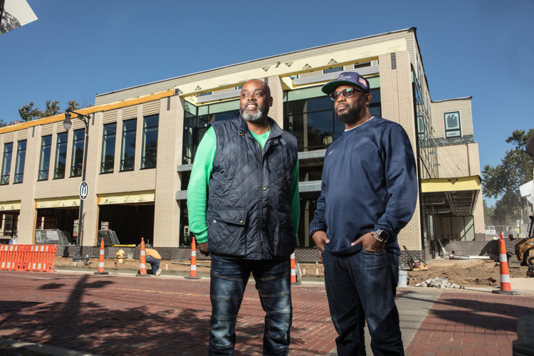Lewis Williams, left, and  Darel Ross II in front of the future site of Forty Acres. 
