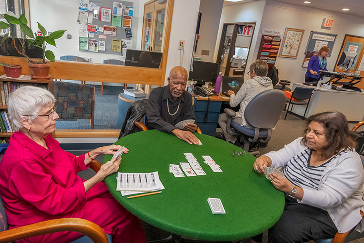 Clients play cards at Turner Senior Resource Center.