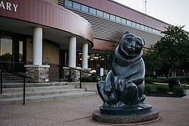 The “Two Bears” sculpture by Marshall M. Fredericks in front of the Sterling Heights Public Library.