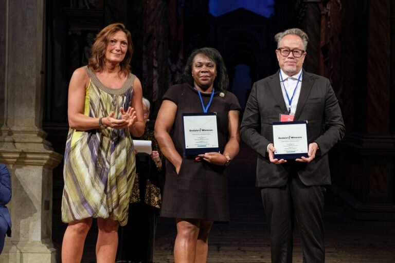 Kresge Detroit Program Managing Director Wendy Lewis Jackson and architect Marlon Blackwell receive Dedalo Minosse award citations. At left is Dr. Valentina Galan, Director of Cultural Heritage and Activities of the Veneto Region.