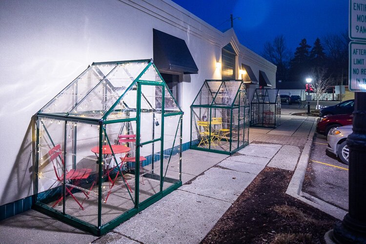 Greenhouses have been converted to outdoor dining pods in downtown Farmington